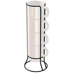 a tall white vase sitting on top of a metal stand with four cups in it