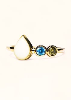 Featuring our classic love drop bezel, shaped like a teardrop, the Liquid Gold Drop Ring holds a space for your chosen inclusions -- breast milk, placenta, ashes, etc. This ring also gives you the option to add up to 4 birthstones on the band to represent your babies or loved ones making a ring as beautiful and as unique as your story. Personalize with: Breastmilk - A cherished symbol of the mother-child bond.Cremation ashes - Honor the memory of a loved one.Placenta - Celebrate the miracle of l Making A Ring, Breastmilk Ring, Drop Ring, Classic Love, Mother Child, Cremation Ashes, Liquid Gold, Breast Milk, Bracelets And Charms