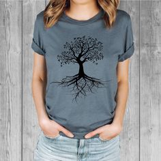 Women's Bella Tri-Blend relaxed unisex fit T-shirt with a Tree of Life screen printed graphic design.  Super soft, stretchy, and comfy material.   Available with black or white ink! FIT: Follow the image size chart Unisex Fit - Runs Large - Long Length  Suggest sizing down if you prefer a more fitted look instead of relaxed -  Bella 3.8 oz  Super Soft hand and lightweight  -  Tri Blends:  50% Poly, 25%  Cotton, 25%  Rayon -  Does not shrink -  Hand screen printed to order in Oregon - Model is wearing a size small Fashion Fitted Style  http://etsy.me/2qjx3lC ♥ All of our tees are hand-printed to order in our shop in Portland Oregon! ♥ RETURNS & EXCHANGES We gladly accept exchanges and returns if not worn.   Please follow the chest measurement size guide for fit if you are unsure.  We custom Gray Relaxed Fit T-shirt With Front Print, Tri-blend Graphic Tee With Sublimation Print, Graphic Tee With Sublimation Print In Tri-blend Fabric, Gray Band Merch T-shirt With Crew Neck, Gray Band Merch Crew Neck T-shirt, Gray Crew Neck Band Merch T-shirt, Gray Relaxed Fit T-shirt With Screen Print, Comfortable Graphic Print Crew Neck T-shirt, Comfortable Crew Neck Shirt With Graphic Print