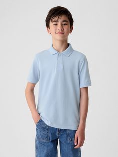 Soft woven knit uniform polo shirt.  Polo collar, buttons at front.  Short sleeves.  Straight, easy fit.  Hits at the hip. Blue Collared Polo Shirt With Button Closure, Blue Casual Polo Shirt For School, Casual Blue Polo Shirt For School, Blue Casual School Polo Shirt, Classic Cotton Polo Shirt For School, Classic Solid Polo Shirt For School, Casual Cotton Polo Shirt For School, Casual Cotton School Polo Shirt, Classic Blue Button-up Polo Shirt