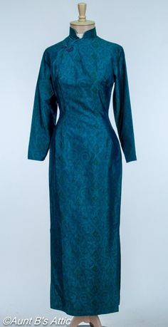 Traditional Blue Ao Dai For Formal Occasions, Elegant Blue Ao Dai For Formal Occasions, Traditional Blue Fitted Ao Dai, Elegant Blue Fitted Ao Dai, Traditional Fitted Blue Ao Dai, Spring Formal Fitted Ao Dai, Fitted Cheongsam For Evening, Fitted Long Sleeve Cheongsam For Evening, Blue Fitted Ao Dai For Evening