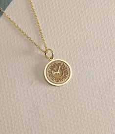 14K Real Solid Gold  clock gold necklace ● Material of pendant: Solid Gold 14k ( REAL GOLD ) ● Metal Stamp: 14L ( REAL GOLD ) ● The pendant is available in 6 sizes: - 14,0 mm / 0,55 inches ( Diameter ) In the photos - 15,3 mm / 0.60 inches ( Diameter ) - 16,5 mm / 0,65 inches ( Diameter ) - 19,1 mm / 0,75 inches ( Diameter ) - 21 mm / 0,82 inches ( Diameter ) - 23 mm / 0.90 inches ( Diameter ) ( In the photos the size is 14mm / 0.55 inches Diameter ) ( Jump Ring inner diameter: 4 mm ) ● Material Clock Necklace Aesthetic, Timeless Gold Jewelry Stamped 14k, Timeless 14k Stamped Gold Jewelry, Timeless 14k Gold Coin Pendant Necklace, Recycled Gold Coin Pendant Jewelry Gift, 14k Gold Coin Pendant Charm Necklace, 14k Yellow Gold Tarnish Resistant Charm Necklace, 14k Gold Medallion Charm Necklace, Timeless Gold Charm Necklaces With Pendant