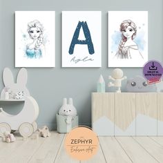 three children's art prints on the wall