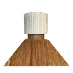 a wooden stove hood with a white top