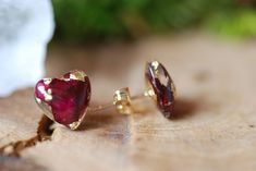 Heart Red Rose Flowers with 24K Gold Flakes Resin Stud Earrings A tiny heart shape floral stud earrings made with red rose petals and 24K Gold flakes in Eco resin into a gold plated over brass post and earring back. All natural ingredients gathered around my dwelling. Earrings diameter measure from 10mm. Please notice that the rings are truly handmade and some bubbles may appear since it is an artisan product from beginning to end. Every single one of my pieces has been uniquely designed by me w Rose Gold Ruby Earrings For Gifts, Pierced Earrings As A Valentine's Day Gift For Her, Gold Heart Cut Earrings Gift For Her, Gold Heart Cut Earrings As A Gift For Her, Gold Heart Cut Earrings For Her, Red Heart Earrings For Gift, Red Round Heart Earrings For Gift, Rose Gold Heart Earrings For Gift, Elegant Red Heart-shaped Earrings