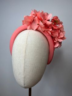 An elegant wide coral headband, featuring a cluster of artificial hydrangea petals. This Headband is stunning, perfect for all summer events, weddings and races. Brand New. If you need your item by a certain date please let me know. Made in the UK. Custom orders are welcome. Many more items are available in our Shop. Summer Adjustable Headpieces With Flower Decoration, Adjustable Summer Headpiece With Flower Decoration, Summer Adjustable Flower Decoration Headpieces, Summer Wedding Flower Hair Accessories, Summer Flower Headband, Handmade Flower Hair Accessories For Summer, Summer Flower Headband For Garden Party, Summer Adjustable Headpiece With Handmade Flowers, Summer Wedding Flower Headband