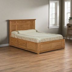 a wooden bed frame with two drawers on each side