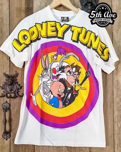 #looneytunes #cartoon #cartoontee #tee #tshirt #BugsBunny #DaffyDuck #Tasmanian #streetwear #vintagereprint #y2k #shopvintage #thrift #thriftshop #90sstyle #vintageclothing #vintaget #bootleg Retro Character Print T-shirt For Fan Conventions, Retro Pre-shrunk T-shirt For Fan Conventions, Retro T-shirt With Screen Print For Fan Conventions, Vintage Tops With Character Print For Fan Conventions, Vintage Character Print Tops For Fan Conventions, Retro Graphic Print T-shirt For Fan Conventions, Vintage Graphic Print T-shirt For Fan Conventions, Retro Screen Print Tops For Fan Conventions, Vintage White T-shirt With Character Print