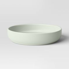 a white bowl sitting on top of a table