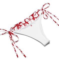 Indulge in the luxurious and exclusive style of our White Hawaiian Flowers on Red String Bikini. This beautiful string bikini set is not only comfortable, but it also offers double-layering and UPF 50+ protection. Customize the straps to your liking and get ready to turn heads at the beach! Made from soft recycled polyester, this bikini is both stylish and sustainable. • Soft and stretchy material with UPF 50+• Sizes up to 6XL• Bikini top comes with removable padding for comfort• Multiple ways to tie and style the bikini set *Need a small top and medium bottom or large top and small bottom? No problem! Separates in all sizes (Top and Bottom) with this design are listed and sold separately...now that's something to be Extremely Stoked about!Disclaimers: • Due to the 2-layered construction a White String Tie Swimwear For Sunbathing, White String Tie Swimwear For Summer, White String Tie Swimwear For Pool, White String Tie Swimwear For Beach Season, Red Adjustable Tie-side Swimwear Bottom, Adjustable Red Swimwear For Beach, Red Adjustable Swimwear For Summer, Adjustable Red Swimwear For Summer, Adjustable Red Swimwear For Vacation