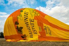 a large yellow and orange hot air balloon