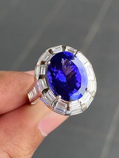 Luxury Tanzanite Sapphire Ring For Promise, Luxury Tanzanite Ring With Bezel Setting, Luxury Tanzanite Gemstone Diamond Ring, Luxury White Gold Tanzanite Jewelry, What Should I Write About, Tanzanite And Diamond Ring, How To Explain, Baguette Diamond Ring, Tanzanite Engagement Ring