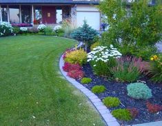 the front yard is neatly trimmed and ready to be used as a flower bed or planter