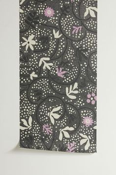 an image of a black and white flowered pattern on a piece of paper with pink flowers