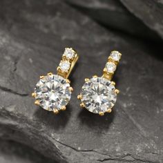 Gold CZ Diamond Earrings set with Created CZ Diamonds in a flawless clarity & color at 10mm (4 Ct a pair).Gold Vermeil: 18k Gold over Solid 925 Sterling Silver ☞ made to last.Click here for ☞ Matching RingMatching Pendant ☞ please ask meDetails:• Created CZ Diamonds in a flawless clarity• CZ Diamond: 10mm each, 4 Ct a pair, diamond cut• Lever Back Closure - "English Lock"• Dimensions: Length 20mm, Width 10mm• 18k Gold VermeilSKU 2073 Classic Gold Diamond Clip-on Earrings, Anniversary Clip-on Earrings With Diamond Accents, Classic Cubic Zirconia Clip-on Earrings For Gift, Diamond White Cubic Zirconia Clip-on Earrings For Anniversary, Classic Gold Plated Diamond Earrings, Classic Yellow Gold Diamond Clip-on Earrings, Classic Cubic Zirconia Clip-on Earrings, Classic Brilliant Cut Clip-on Earrings For Anniversary, Gold Moissanite Earrings For Anniversary