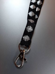 Stretch lanyard  Limited edition! Stitched stretch lanyards with lobster hook. Single sided print. Made for durability and decorative functionality! Love these 😍 Elegant Cruise Lanyards, Black Lanyard With Key Leash For Personal Use, Adjustable Black Lanyards For Personal Use, Adjustable Lanyard With Lobster Clasp For Personal Use, Adjustable Lanyard With Lobster Clasp For Gift, Adjustable Lanyards With Swivel Clip For Everyday Use, Adjustable Lanyard With Swivel Clip For Everyday Use, Adjustable Black Badge Holder With Key Leash, Adjustable White Lanyard With Key Leash