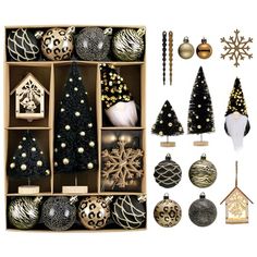 an assortment of christmas ornaments and decorations in wooden boxes, including tree ornament