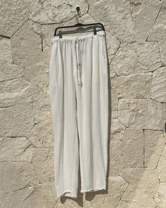 Color: White Size Large-XL Lenght 110 cm / Width 54 cm / Cross: 37 cm Fit: Oversized Fit 2 pockets 100% Cotton Handmade in Tulum, Mexico DeliveryOrders will usually ship whitin 2-3 business days from Tulum, Mexico 100% Delivery Guarantee. If a product you ordered arrived damaged/broken or was lost during delivery -we will resend you the same product again without any additional cost! White Vacation Bottoms With Side Pockets, White Linen Ankle-length Bottoms, White Bottoms With Straight Hem For Summer, White Wide Leg Bottoms With Side Pockets, Cream Bottoms For Beach With Relaxed Fit, White Relaxed Fit Linen Bottoms, Cream Relaxed Fit Bottoms For Vacation, White Bottoms With Side Pockets And Straight Hem, White Relaxed Pants With Elastic Waistband