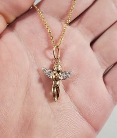 "Vintage 14k Diamond Angel Pendant Length: 1 1/16\" Width: 9/16\" Weight: 2 grams Tested: 14k Chain for display only" Rose Gold 14k Jewelry With 17 Jewels, Valentine's Day Sterling Silver 14k Stamped Jewelry, Valentine's Day 14k Gold Hallmarked Jewelry, Fine Jewelry Stamped 14k For Valentine's Day, Gold Diamond Jewelry Stamped 14k, Yellow Gold Pendant Jewelry For Memorial, Collectible 14k Gold Jewelry With Polished Finish, 14k Gold Diamond Cut Jewelry For Valentine's Day, Yellow Gold Sterling Silver Jewelry For Memorial