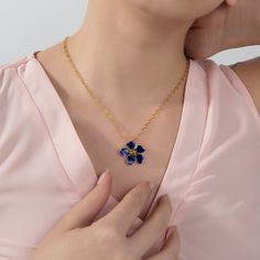 The cherry blossom flower necklace is an extremely feminine and timeless necklace. This wonderful piece works well both worn by itself or layered with your current necklace collection. Surprisingly light-weight. It is handmade with 22K gold plated brass. On top of the gold plating, enamel is applied for these magnificent colors. This beauty comes with the Milou Jewelry box For avoiding damage to your jewels, take care that they do not contact hard chemicals. In order to prevent friction and cont Blue Cherry, Cherry Blossom Flowers, Navy Women, Blossom Flower, 22k Gold, Flower Necklace, Small Flowers, Independent Designers Fashion, Cherry Blossom