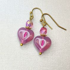 Berry Pink Glass Heart Earrings - Czech Glass Hearts - Pink Purple Beads - Boho Jewelry - Bronze Earrings - Gift for Her by JezaJewelry on Etsy Pink Heart Earrings For Wedding, Elegant Pink Beaded Earrings For Gift, Pink Glass Party Jewelry, Pink Heart-shaped Crystal Earrings For Valentine's Day, Pink Heart Crystal Earrings For Valentine's Day, Elegant Pink Heart-shaped Earrings, Elegant Pink Czech Glass Earrings, Pink Heart Beads Dangle Jewelry, Elegant Pink Teardrop Beaded Earrings