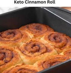 a pan filled with cinnamon rolls sitting on top of a counter