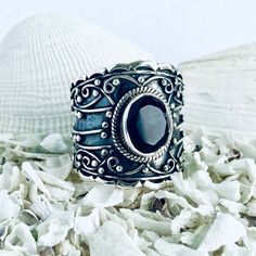 Title:  The Queenly Exquisitely handcrafted sterling silver ring enhanced with tiny filigree and granulations. This ring is set with a vibrant black onyx surrounded by a rope-patterned bezel setting.  Dare to dazzle with a piece of jewelry designed to beautify your hand. Inspiration: Inspired by the kings and queens of the late Middle Age. Throughout history, onyx has been thought to bring powers of protection and defensive magic. In classical ceremonial magic, the image of the head of the god M Unique Handmade Black Engraved Ring, Black Filigree Ring Jewelry, Unique Black Sterling Silver Engraved Ring, Black Filigree Ring, Ornate Black Sterling Silver Rings, Unique Black Engraved Ring For Gift, Black Sterling Silver Filigree Ring As A Gift, Unique Black Oxidized Finish Ring, Silver Sterling Filigree Ring With Stone Setting