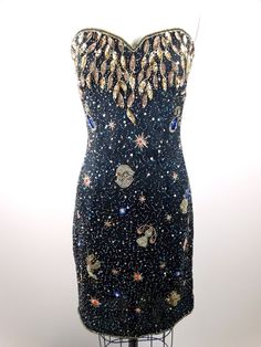 "An AMAZING dress fully embellished with sequins and beads all over in abstract astrology designs. It's in perfect condition! Measurements: Bust - 34/36\" Waist - 28/30\" Hips - 36/38\" Dress Length - 32\" This dress comes from a pet-free and smoke-free home. If you would like more info or have any questions, please don't hesitate to ask!" Celestial Mini Dress, Space Themed Dress, Astrology Dress, Stars In Space, Junk Kouture, Gold Beaded Dress, Bday Dress, Sparkly Party Dress, Space Dress