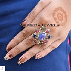 Tanzanite Gemstone Ring, Ruby Gemstone Ring, Sapphire Gemstone Ring, Pave Diamond Jewelry, 925 Silver Jewelry, Gold Vermeil Jewelry, Gifts Gross Weight: 16.34 gram Diamond Weight: 1.20 cts Gemstone Weight: 16.85 cts Ring Size: 38X34 MM NOTE:- All The Products Are Designed And Manufactured In My Workshop By Me & My Team. Shown Products Are Purely Handmade. Custom Orders Are Open Handly Accepted. We Are the Perfect Choice For Any Custom Jewelry Manufacturing. For Bulk Orders Please Message me. Elegant Multicolor Toe Ring Jewelry, Oval Multicolor Hallmarked Ring, Multicolor Round Gemstones With Stone Setting, Multicolor Gemstone Cluster Ring, Multicolor Oval Hallmarked Ring, Multicolor Flower Ring For Wedding, Sterling Silver Multi-stone Diamond Ring, Multicolor Sapphire Jewelry With Accent Stones, Multicolor Sapphire Jewelry For Weddings