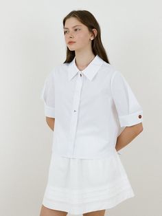 This is a trendy and casual top by Charles de Rohan that is made out of high quality and sturdy material. With distinctive mood of the design and comfortable wear, you can style it for your casual daily outfit.- Unbalanced front and back length- Voluminous A line silhouette- Fabric suitable for summer- Trendy and casual mood Versatile White Shirt For Spring, Trendy White Cotton Blouse, Trendy White Tops For Daywear, Trendy White Top For Daywear, Versatile White Button-up Top, Versatile Collared Tops For Day Out, Modern White Shirt For Spring, Chic White Short Sleeve Tops, White Cotton Button-up Tops