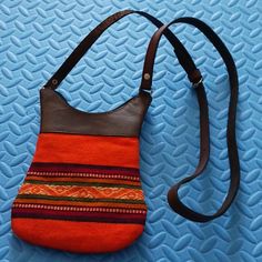 This Is A Small Shoulder Bag Made In Genuine Lather With Peruvian Textil, You Can Use Like Cell Phone Holder Too, It Has Two Secure Pockets With Closure. The Bag Also Is Secure With A Zipper. The Measures Are: 8" Long X 6 Inches, And The Handle Measures 25" Regulable Cell Phone Holder, Small Shoulder Bag, Orange Brown, Phone Holder, Bag Making, Mini Bag, 6 Inches, Cell Phone, Genuine Leather