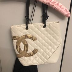 Lightly Used White Chanel Cambon Tote Luxury Square Shopping Bags, Luxury Cream Tote Bag, Elegant Square Bag For Errands, Elegant Cream Bag, Elegant Cream Bags, Designer Cream Shoulder Bag With Dust Bag, White Bags With Removable Pouch As Fashion Accessory, Luxury Cream Square Bag, Designer Beige Shoulder Bag Fashion Accessory