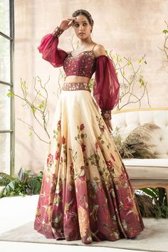 Maroon-cream lehenga with floral print and embroidered waistband. Comes with cold-shoulder blouse.
Component: 2
Printed, Embroidered
Neckline: Sweetheart
Sleeve Length: Full
Fabric: Dola Silk; Sleeves: Organza
Color: Maroon
Embroidered blouse
Organza cuffed sleeves - Aza Fashions Cold Shoulder Blouse Designs, Lehenga And Blouse, Printed Lehenga, Trendy Outfits Indian, Lehenga Designs Simple, Lehenga Blouse Designs, Gaun Fashion, Indian Dresses Traditional, Lehenga Blouse