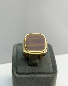 Men Ring with Tiger Eyes Gemstone, Brown Pinky Signet Ring, Square Shape, Stylish Gold / Silver Ring, Handmade Jewelry, Best Gift for Him ◎ Details ◎ ○ Material 14K Solid Gold or 925 Sterling Silver Weight of Ring : approx 18.00 gr Height of Ring : approx 5.30 mm ○ Upgrade to Solid 18K Gold, please click the link below: https://www.etsy.com/listing/962826004 ○ Gemstone Natural Tiger Eyes approx. 15 mm x 15 mm 4.00 ct Made to Order HANDMADE ITEM ○ For Men Collection : https://etsy.me/2PmKJMW All Fine Jewelry 14k Gold Brown Ring, Brown 14k Gold Rings Fine Jewelry, Brown 14k Gold Fine Jewelry Ring, Classic Brown Rings With Polished Finish, Classic Brown Signet Ring For Anniversary, Brown Polished Finish Signet Ring For Formal Occasions, Formal Brown Signet Ring With Polished Finish, 14k Gold Brown Ring, Brown Polished Finish Signet Ring For Anniversary