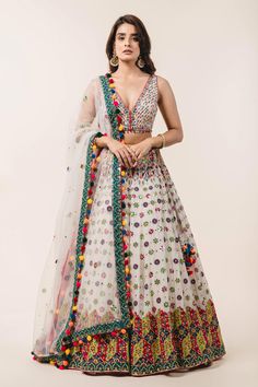 Ivory lehenga with attached cancan, highlighted with applique floral embroidery, sequin embellishments and drawstring at the side with pompoms. Comes with plunging neckline padded blouse and tulle pink dupatta.
Component: 3
Embroidered
Neckline: V-Neck
Sleeve Length: Sleeveless
Fabric: Lehenga and Blouse: Georgette; Dupatta: Tulle
Color: White
Applique, resham and patra embroidery
Embroidered blouse with tie-up at the back
Cutout at the back
Embroidered dupatta with pompoms at the hem
Closure:
B Bohemian Saree-style Wedding Gown, Bohemian Wedding Lehenga With Resham Embroidery, Bohemian Wedding Gown For Diwali, Bohemian Anarkali Set For Wedding With Cutdana, Bohemian Lehenga With Zari Work For Wedding, Bohemian Lehenga With Mirror Work For Reception, Bohemian Cutdana Anarkali Set For Wedding, Bohemian Embroidered Lehenga For Reception, Bohemian Lehenga With Sheer Dupatta For Wedding