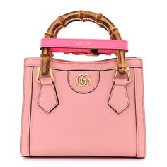 This is an authentic GUCCI Wonka Grain Calfskin Mini Diana Tote Bag in Wild Rose and Fuxia Fluo.This shoulder bagis crafted of lovely calfskin leather in pink. It features bamboo top handles with a fluorescent pink belt handle shaper, and a gold Gucci double G logo. The handbag opens to a beige microfiber interior. Gucci Handheld Bag With Detachable Handle, High-end Pink Top Handle Bag, High-end Pink Handheld Bag, Gucci Leather Top Handle Bag, High-end Pink Bag With Handles, Luxury Gucci Handheld Shoulder Bag, High-end Pink Shoulder Bag With Top Handle, High-end Pink Top Handle Shoulder Bag, Luxury Handheld Gucci Shoulder Bag