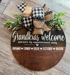 a wooden sign that says grandkids welcome parents by appointment only with burlocks and greenery