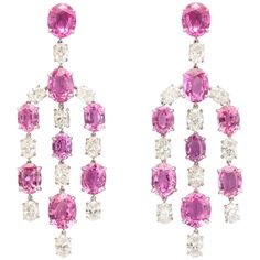 Elegant, and opulent, these wonderful chandelier earclips feature 16 vibrant, pink sapphires (37.20cts total weight) expertly set with the whitest of white diamonds. The seventeen oval diamonds weigh a total of 7.61cts with three of them weighing exactly 1/2 carat each, certified by the GIA E VVS2, E VS1 and D VVS2. The finest clip backs insure comfort for the wearer, while the delicate mounting makes the stones appear to float gracefully beneath the ears. Pink Sapphire Jewelry, Diamond Chandelier Earrings, Titanic Jewelry, Diamond Chandelier, Platinum Diamond Rings, Expensive Jewelry, Antique Earrings, Sapphire Jewelry, Fine Earrings