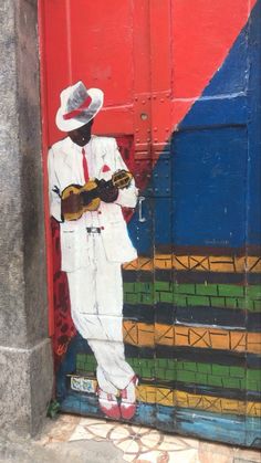 a painting of a man wearing a white suit and red shoes standing in front of a door