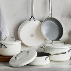 pots and pans are lined up on the counter