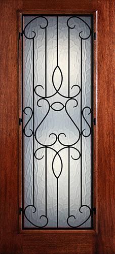 a wooden door with a glass paneled window on it's side and wrought iron bars