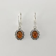 These is a pair of beautiful BALTIC AMBER Earrings from Gdańsk / Danzig, Poland. The earrings are made out of solid 925 Silver and there is no nickel or other substances causing most allergies. This makes the earrings hypo allergenic. Size of one Earring 3.1 x 1.1 cm or  1.22 x 0.43 inch Please note: Our jewelry is photographed close up to show detail and may appear larger than they are. We are happy to help with any questions. You will receive the item in a gift box - perfect to surprise someon Baltic Amber Jewelry, Amber Earrings, Gdansk, Leverback Earrings, Amber Jewelry, Lovely Earrings, Baltic Amber, Jewelry Earrings Dangle, Close Up