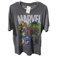 Nwt Marvel Comics Graphic Tee Shirt. Size Large. Crew Neck. Short Sleeves. Approximate Measurements Pit To Pit 21" Length 29" 3495-5 Character Print Graphic Tee For Comic-con, Comic-con Character Print Graphic Tee, Comic-con Character Print Short Sleeve Tops, Pop Culture Tops For Comic-con And Fan Conventions, Casual Tops With Character Print For Comic-con, Fun Cartoon Print Tops For Fan Conventions, Casual Character Print Tops For Comic-con, Pop Culture Graphic Print Tops, Cotton Top For Comic-con Fan Merchandise