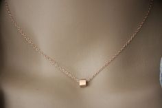 "Minimalist choker necklace, silver sterling pink gold plated with cube pendant - fine pink gold necklace - silver choker - silver cube necklace My rose gold jewelry is made with solid silver findings with 18k rose gold plating.  Necklace in pink gold silver minimalist style. Silver sterling chain with 4cm extension chain. Several lengths available. 1 silver pink gold cube bead 5mm is mounted on the chain. Do not hesitate to contact me if you want another length. ♦ All my jewelry is made to order according to the dimensions you have chosen. Please check your measurements carefully. ♦ My jewelry is also delivered \"ready to offer\" and packaged in a pretty gift bag. Sending neat. For further information, please feel free to contact me via the tab \"contact the creator\" (answer within 24 ho Modern Rose Gold Necklaces As Gift, Modern Rose Gold Necklaces For Gifts, Modern Rose Gold Necklace As Gift, Modern Rose Gold Necklace For Gifts, Modern Rose Gold Necklace Gift, Dainty Jewelry With Delicate Chain And Square Pendant, Rose Gold Square Pendant Jewelry In Sterling Silver, Rose Gold Sterling Silver Square Pendant Jewelry, Delicate Square Pendant With Delicate Chain