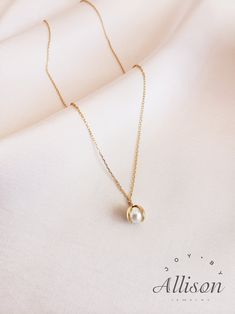 Pearls are used a lot in accessories as gemstones. It looks classy, timeless and elegant, and we agree! However, we try to bring pearl necklaces to a whole new level. Here we present you a necklace with a pendant you've never seen before. Our pendant shows a shell that is opened with a beautiful pearl inside. This is truly a one-of-a-kind piece.  This beautiful necklace is made of 925 sterling silver that is plated with 18K gold. The star of the pendant is a real, freshwater pearl. The length of the necklace is 40 cm while the pendant's length is 2.2 cm. Our jewelry comes with a pouch for safekeeping. A wonderful gift option for a lover, mother, or daughter. Show how much you care by giving them this amazing necklace. A beautiful piece to symbolize beauty, elegance, and class. Suitable for Classic 14k Gold-filled Clavicle Chain Jewelry, Formal White Charm Necklace With Clavicle Chain, Elegant Gold Plated Necklace As Gift, Elegant Everyday Jewelry With Pearl Drop, Elegant Everyday Pearl Drop Jewelry, Elegant Rose Gold Necklace For Everyday Wear, Timeless Everyday Pearl Jewelry, Elegant Rose Gold Necklace For Everyday, Fine Jewelry Pearl Pieces For Everyday