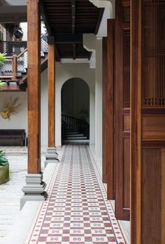 an ornate tiled walkway leads to the second floor