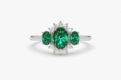 "Emerald Ring / 14k Three Stone Emerald Cluster Ring / Classic Emerald Engagement Ring 14k Gold / May Birthstone / Promise Ring Black Friday Ferkos Fine Jewelry Features *Made to Order *Gold Kt: 14K (also available in 18K) *Available Gold Color: Rose Gold, Yellow Gold, White Gold *Oval Shape Emerald: 1 pc 6 x 4MM *Oval Shape Emerald: 2 pc 4x3MM *Round Diamonds: 10 pcs 1.55 MM *Sapphire CTW: 0.90 ctw *Diamond CTW: 0.16 ctw *Ready to Ship in 7-10 Business Days If you have any additional questions Emerald Cluster Ring In White Gold, Anniversary Three Stone Gemstone Ring, Anniversary Three-stone Ring Gemstones, May Birthstone Cluster Ring With Gemstones, Gemstone Cluster Ring For May Birthstone, Cluster Emerald Ring In White Gold With Gemstone, Cluster Ring With Center Stone In Emerald, Cluster Emerald Ring In White Gold, Emerald Cluster Ring With Center Stone