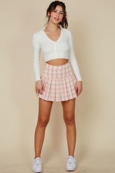 A mix of stylish and sweet, our high waist tennis mini plaid skirt is perfect for dressing to impress, but with a comfy feel. Complete with pleated detail at the hem and plaid design, it's sure to give a cute and trendy look. Pair with a cropped long sleeve cardigan and sneakers. Model is wearing size small Pink Plaid Skirt Outfit, Pink Tennis Skirt Outfit, Mini Plaid Skirt, Pink Tennis Skirt, Plaid Tennis Skirt, Pink Plaid Skirt, Plaid Skirt Outfit, Tennis Skirt Outfit, Cropped Long Sleeve