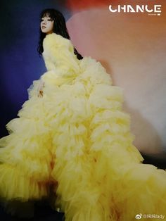 a woman in a yellow dress is posing for a magazine cover with the words china on it