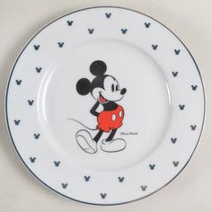 a mickey mouse plate on a white table